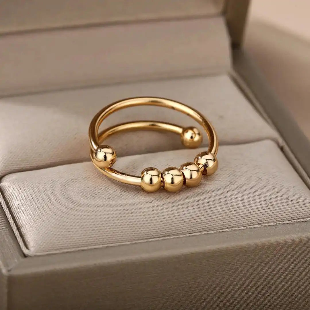 Bague ajustable à perles rotatives