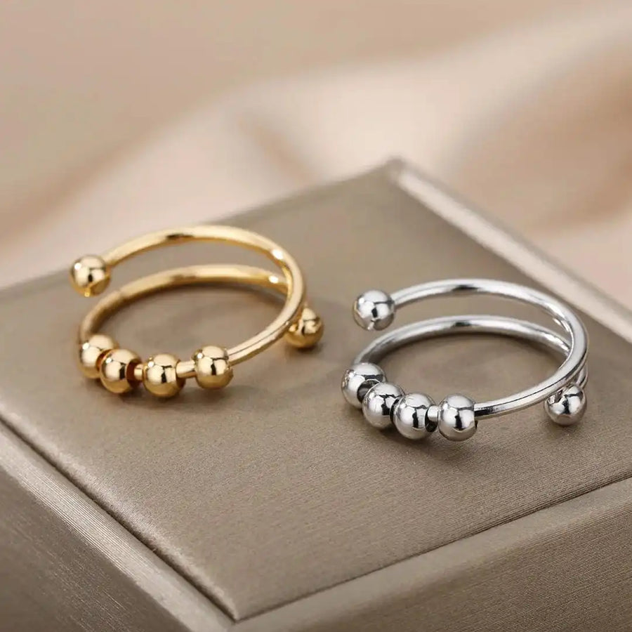 Bague ajustable à perles rotatives