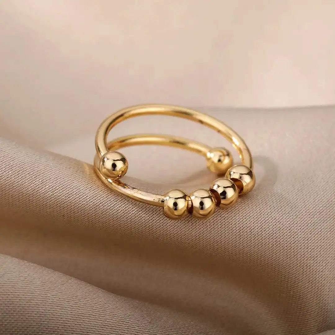Bague ajustable à perles rotatives