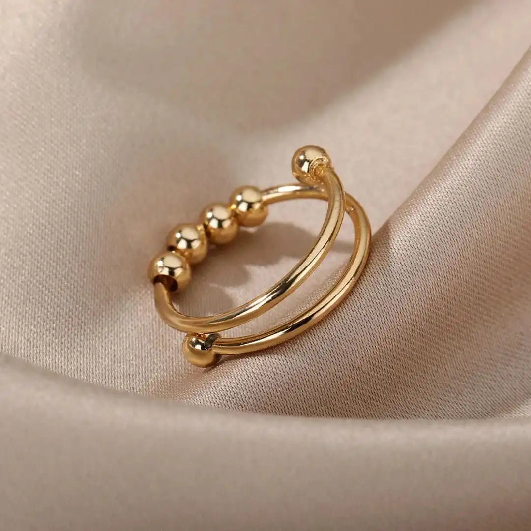 Bague ajustable à perles rotatives