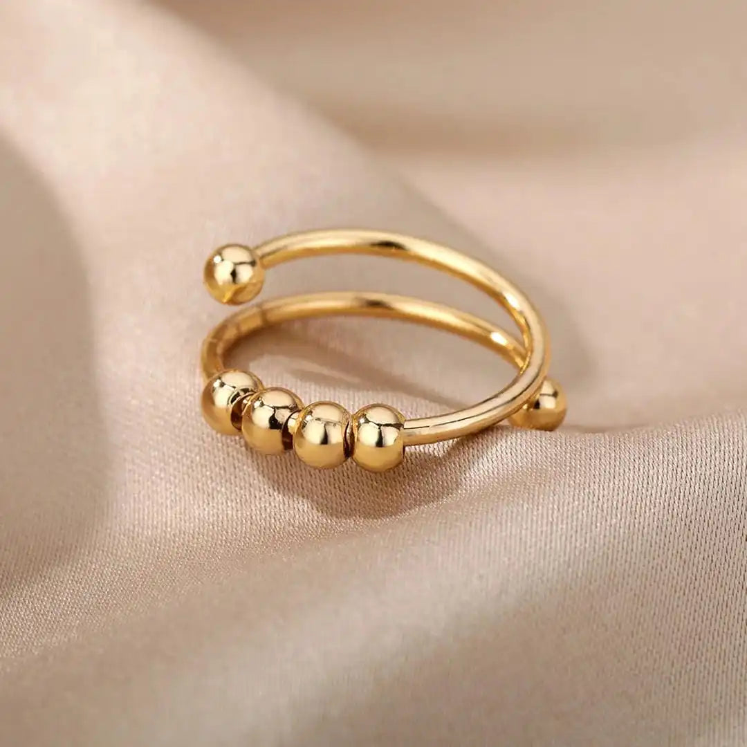 Bague ajustable à perles rotatives
