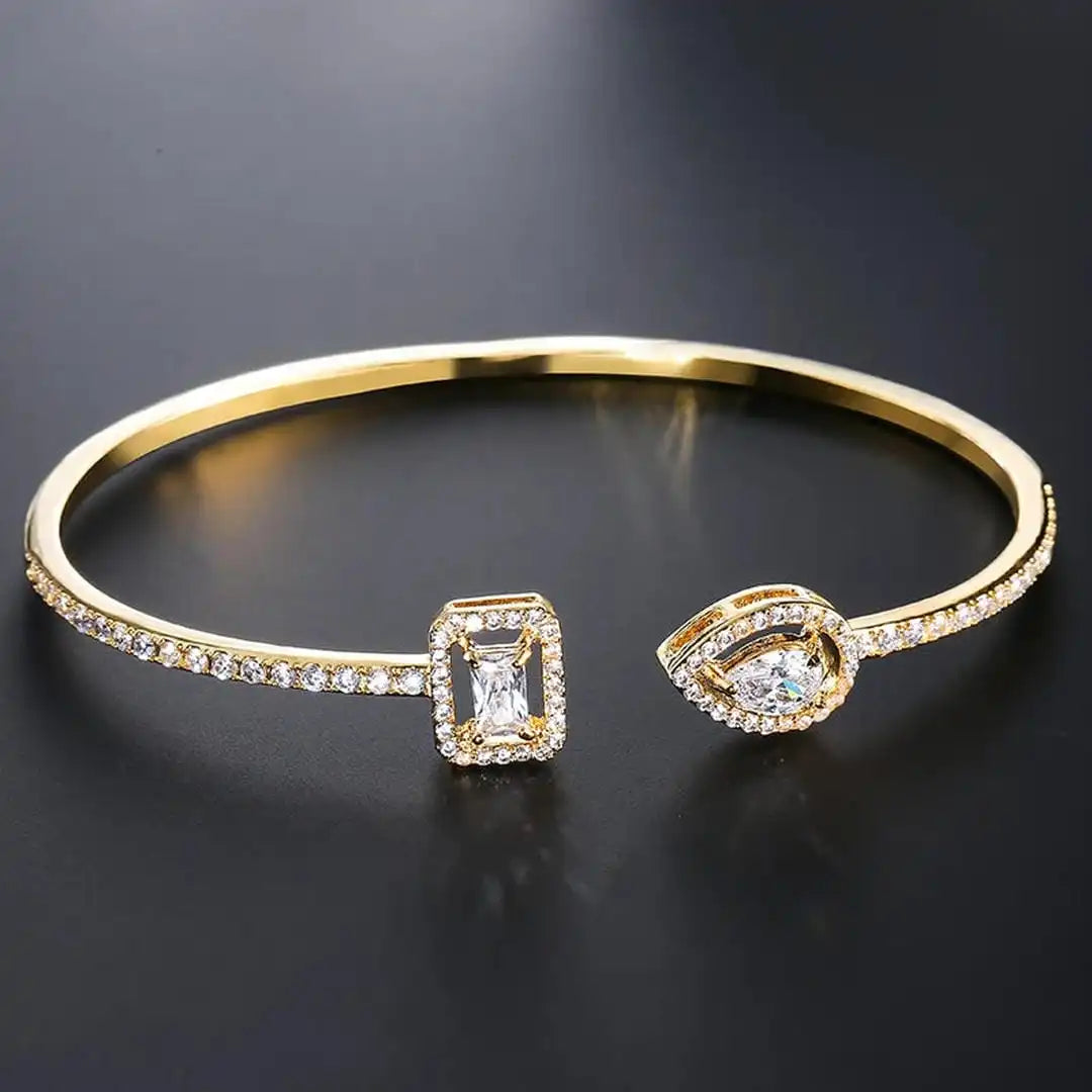 Bracelet jonc ouvert doré à deux pierres