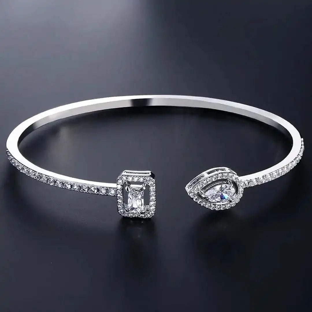 Bracelet jonc ouvert doré à deux pierres