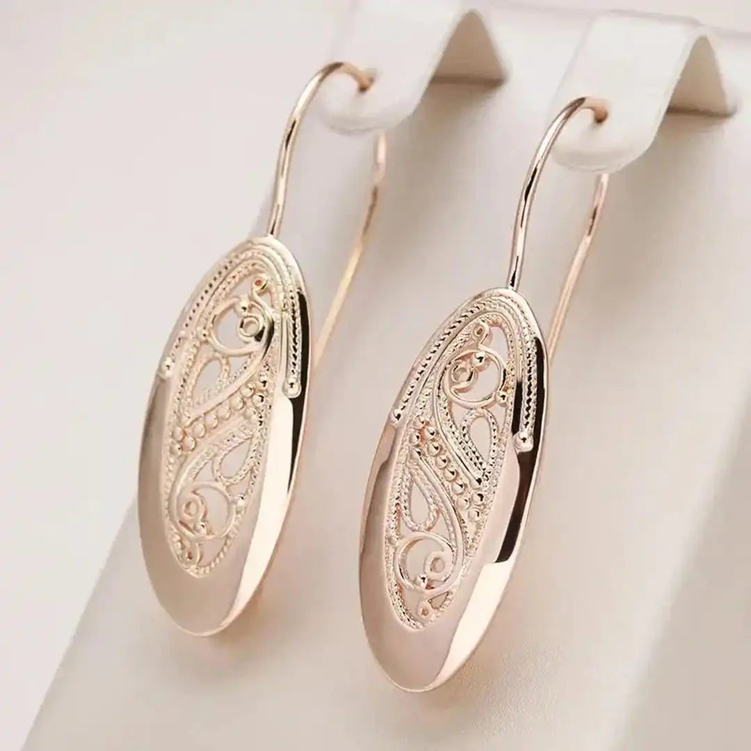 Boucles d'oreilles pendantes dorées Radiance